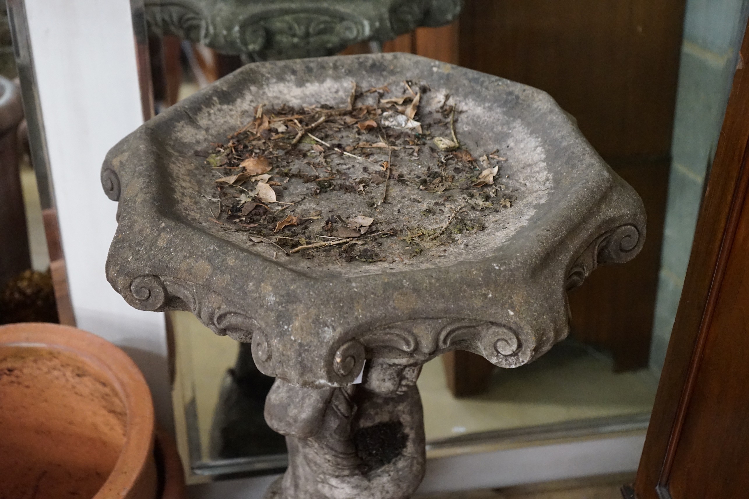 A reconstituted stone garden bird bath, diameter 56cm, height 88cm